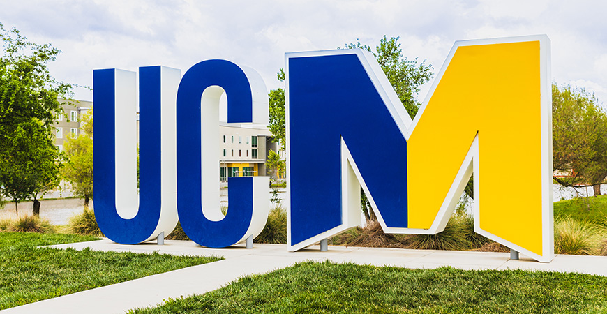 UCM letters in blue and gold